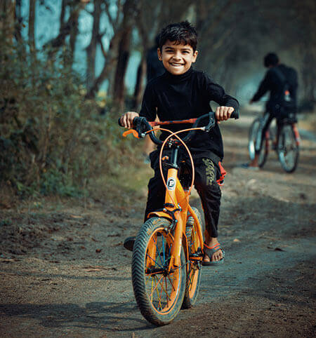 boy riding bicycle