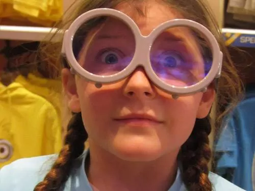 Opto-Mization optometry clinic interior showcasing vision therapy equipment and patient consultations.