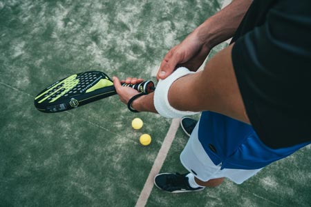 man holding racket