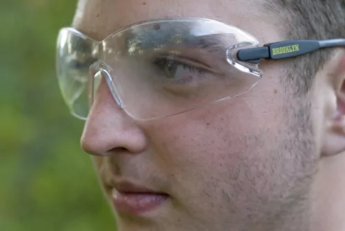 Opto-Mization optometry clinic interior showcasing vision therapy equipment and patient consultations.