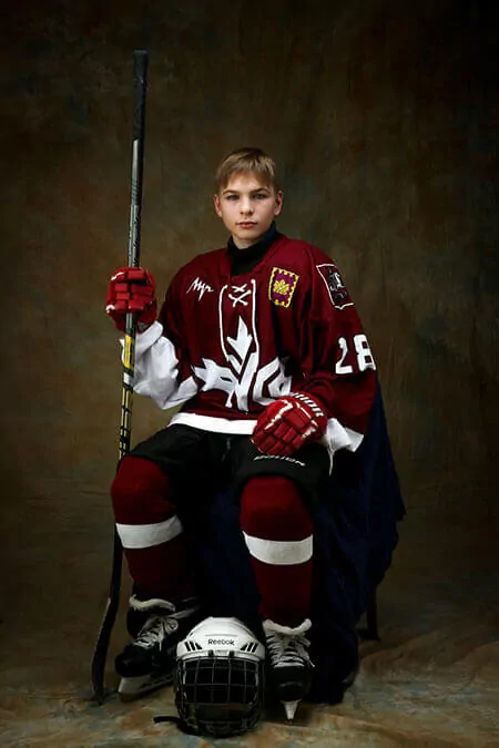 young hockey player in red